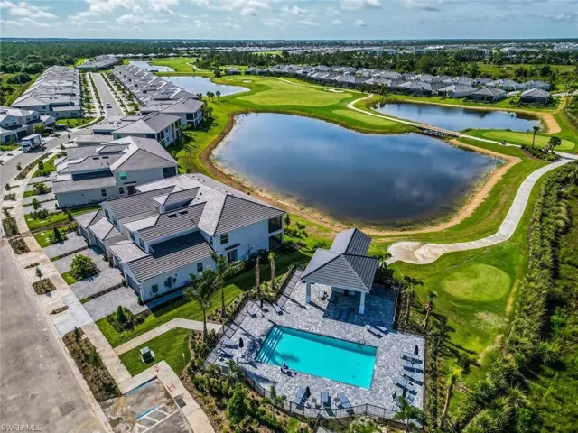 Aerial perspective of suburban area with a large body of water