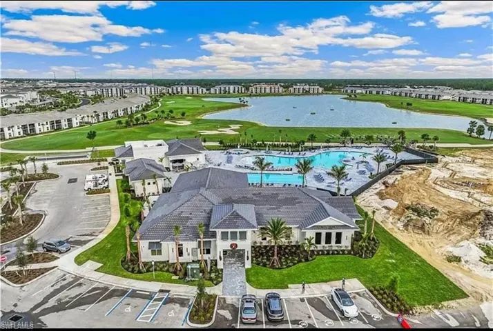 Bird's eye view of a local golf course and a large body of water