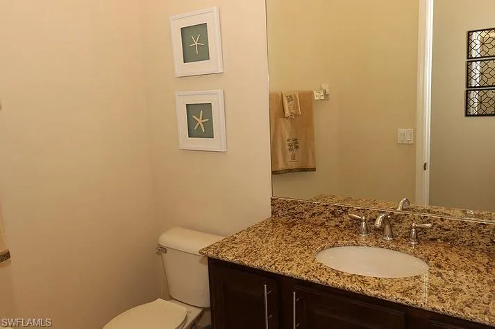 Bathroom featuring toilet and vanity