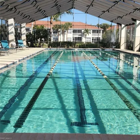 Community pool featuring a patio