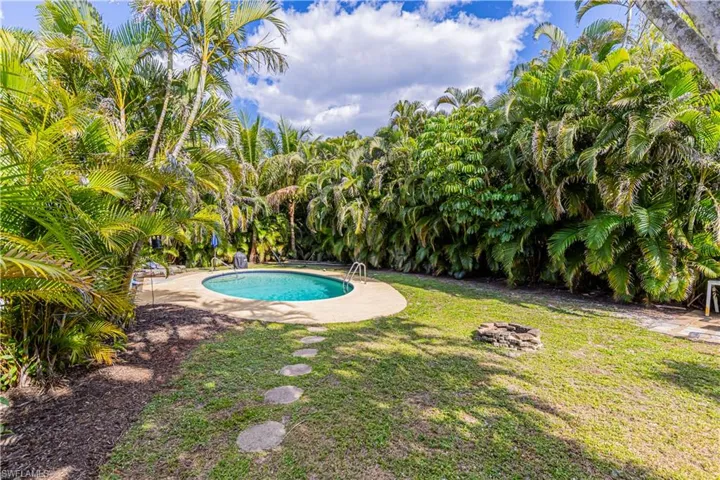 Outdoor pool with a yard