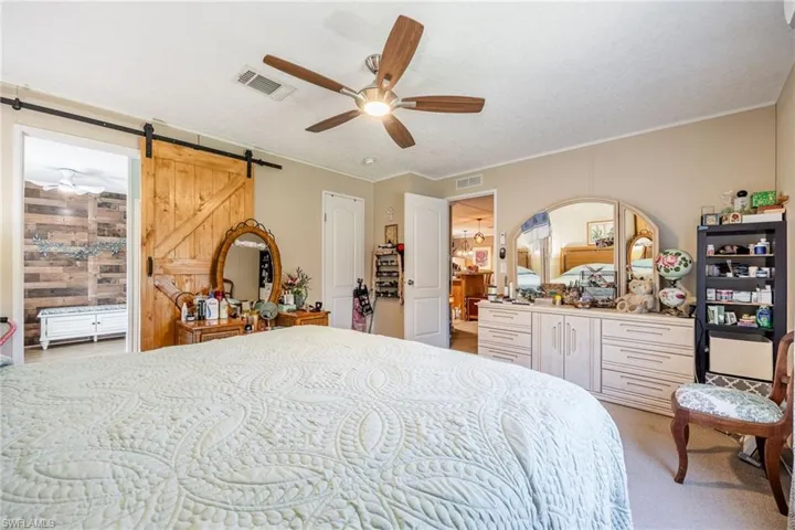 Master Bedroom 14X12  has plenty of room for this King bed and additional furnishings. Barn door leads to the very spacious Master bath