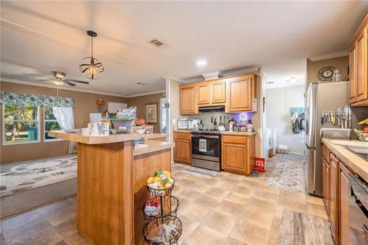 Another look from the Dining room through the Kitchen to Laundry room.
