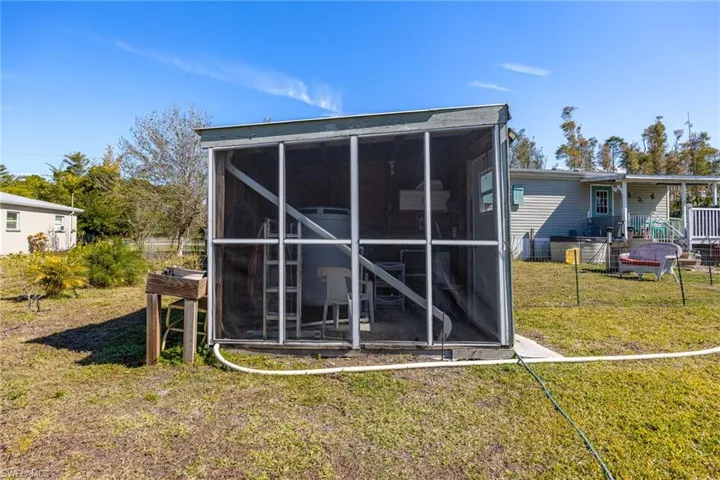 Very nicely secured pump house with extra covered and screened storage. Concrete floor.