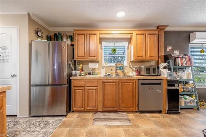 No problem washing dishes here as you look out to survey your acre property, gardens, and dreams