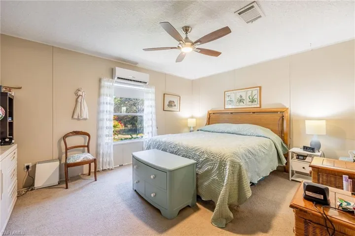 Master Bedroom. King sized bed with power adjustable frame conveys along with other misc. furnishings.