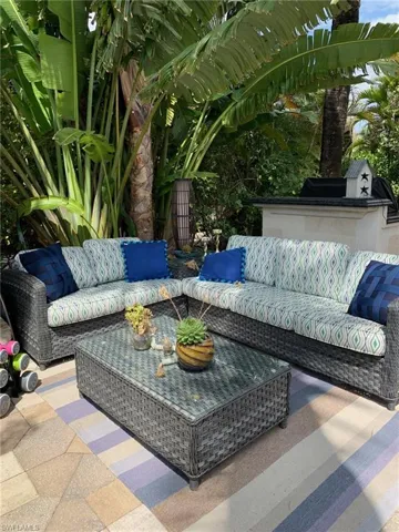 View of patio with an outdoor hangout area