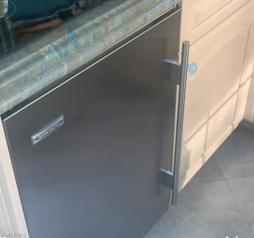 Detailed view of stainless steel refrigerator