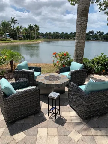 Balcony featuring a water view and outdoor lounge area