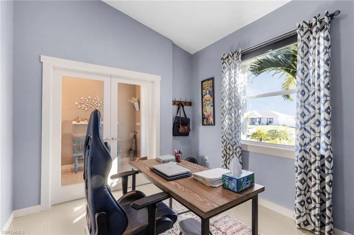 Tiled office featuring french doors