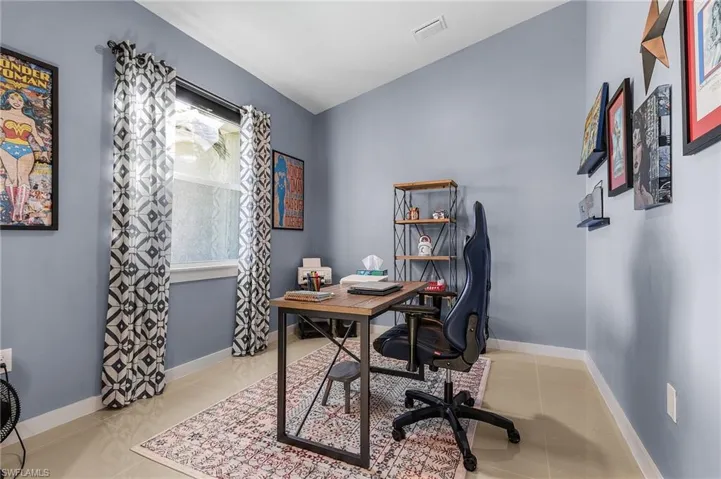 Office space featuring plenty of natural light and light tile patterned floors