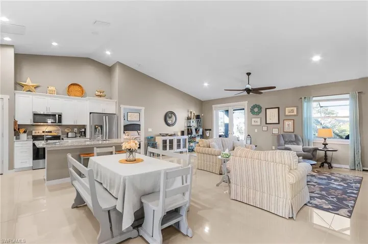 Dining space featuring a wealth of natural light, ceiling fan, and light tile patterned flooring