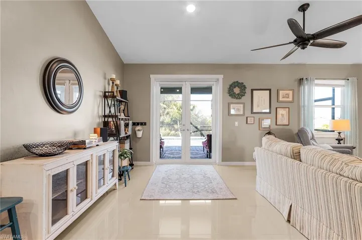 Entryway featuring french doors and light tile patterned floors