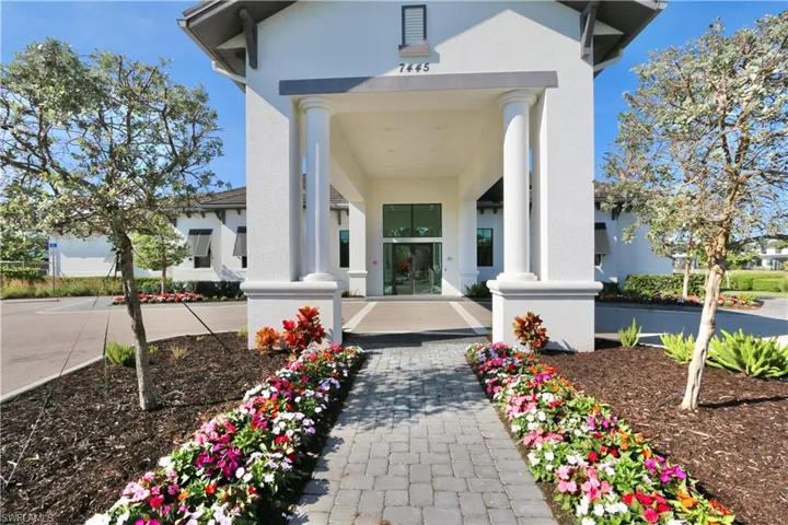 Entrance to property with stucco siding