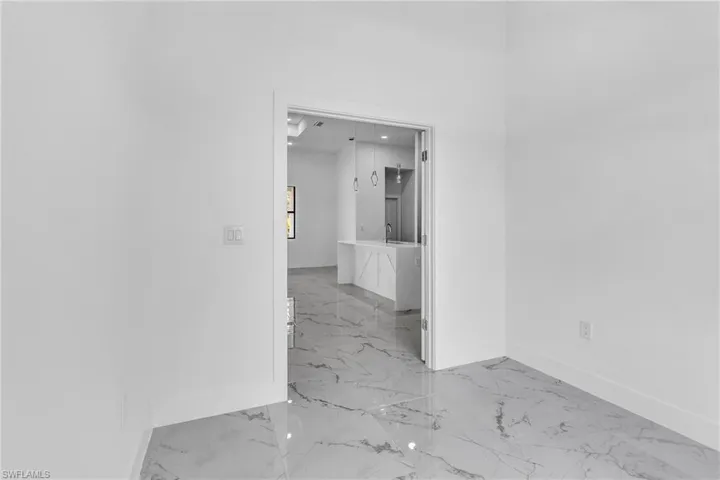 Empty room with baseboards and light marble finish flooring