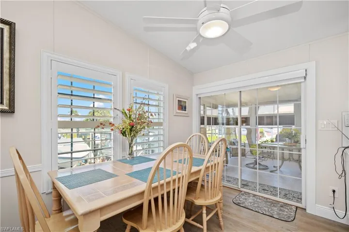 Breakfast Nook with Water Views and Sliders to Florida Room with Electric Blinds