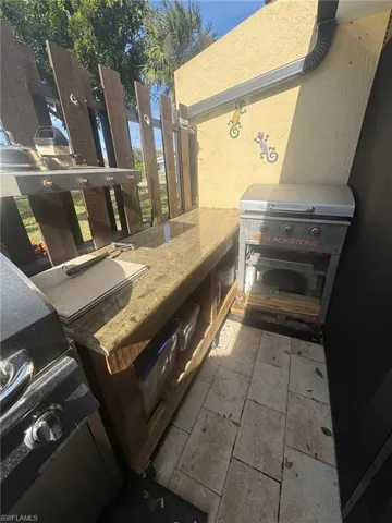 Patio / terrace with exterior kitchen