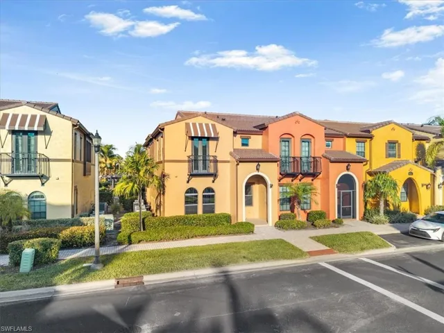 Mediterranean / spanish house with stucco siding, a balcony, and a tile roof
