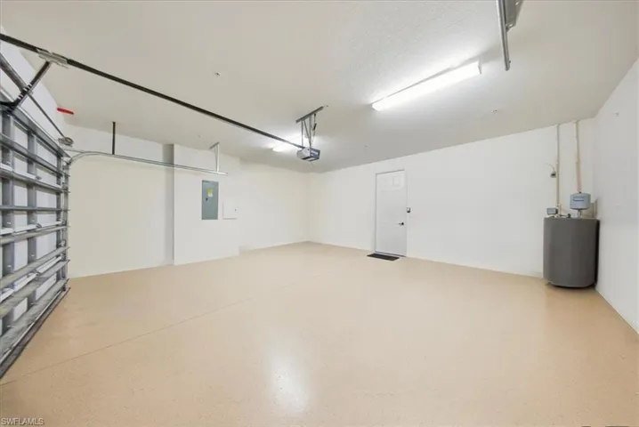Garage with electric panel and water heater