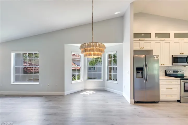 Dining Room with plentiful windows and open concept