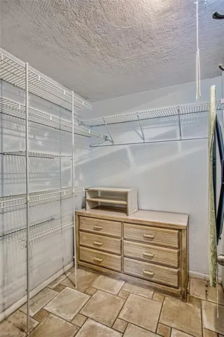 Primary Bedroom walk-in closet