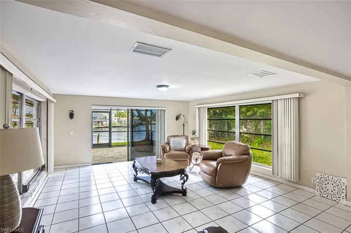 Family Room has slding doors that leads to lanai and great view of canal