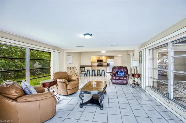 View from lanai of family room,  dining and kitchen.  Abundance of natural lighting