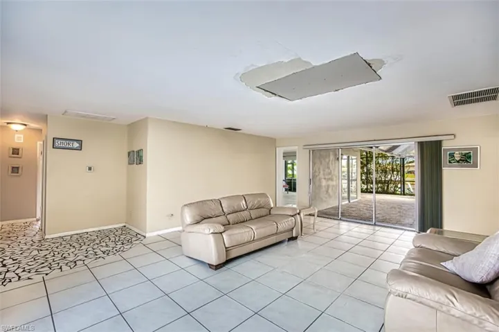 Living/Dining Room with sliders that exit to lanai