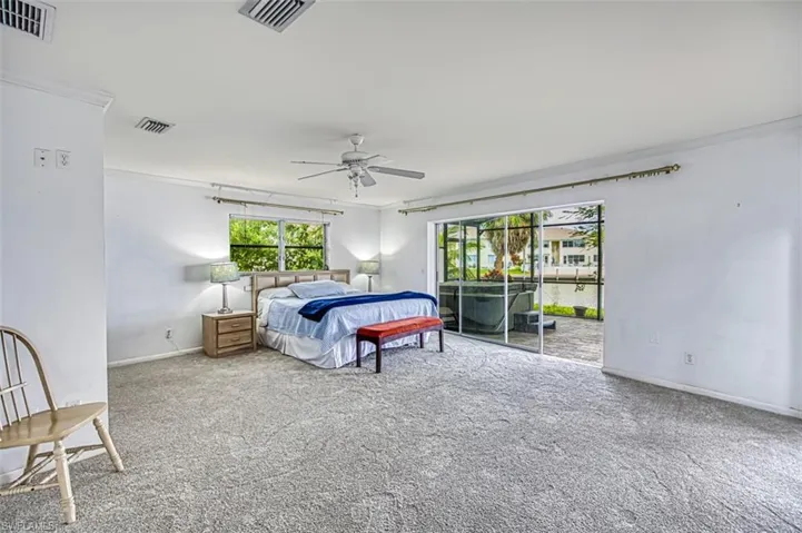 Primary Bedroom with slider door that exits to lanai