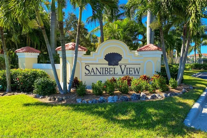 Community sign featuring a lawn