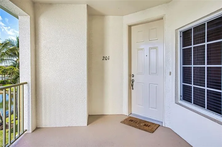 Property entrance with stucco siding