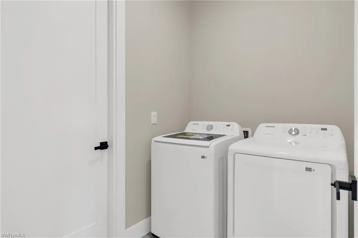 Laundry area featuring separate washer and dryer