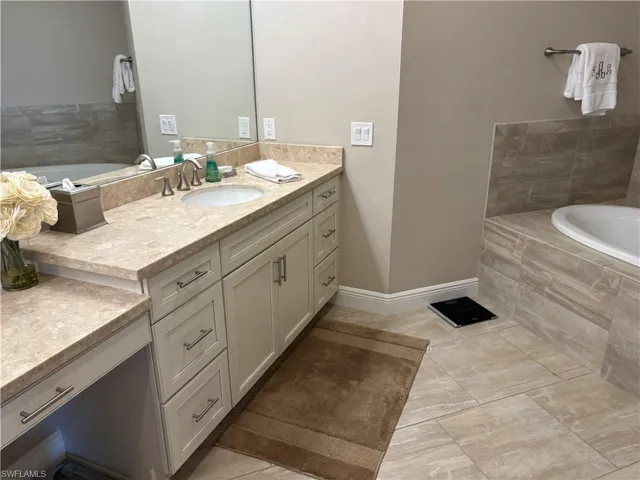 Bathroom with a garden tub and vanity