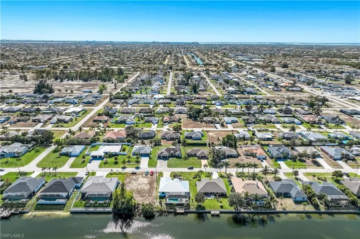 Aerial view of property's location featuring fresh water canal