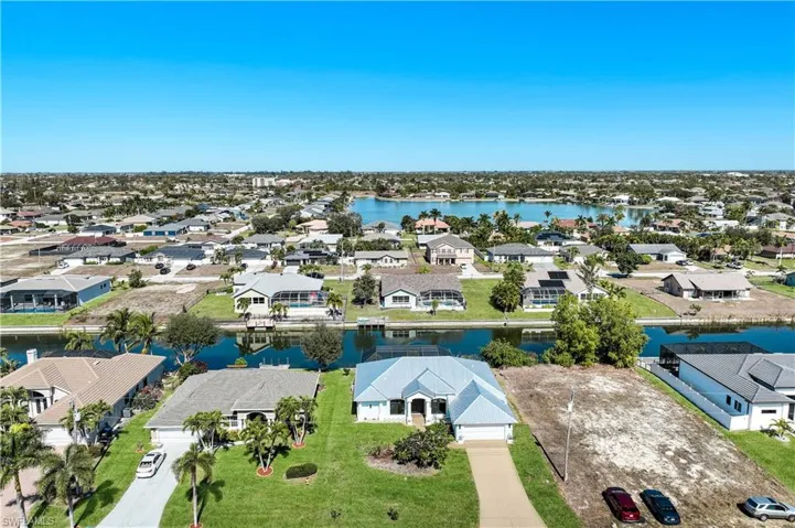Aerial view of residential area with canal in the back