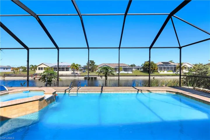 Integrated pool / spa with canal view, and a lanai