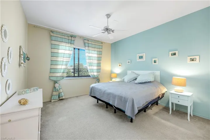 Guest bedroom 2 featuring a ceiling fan and baseboards