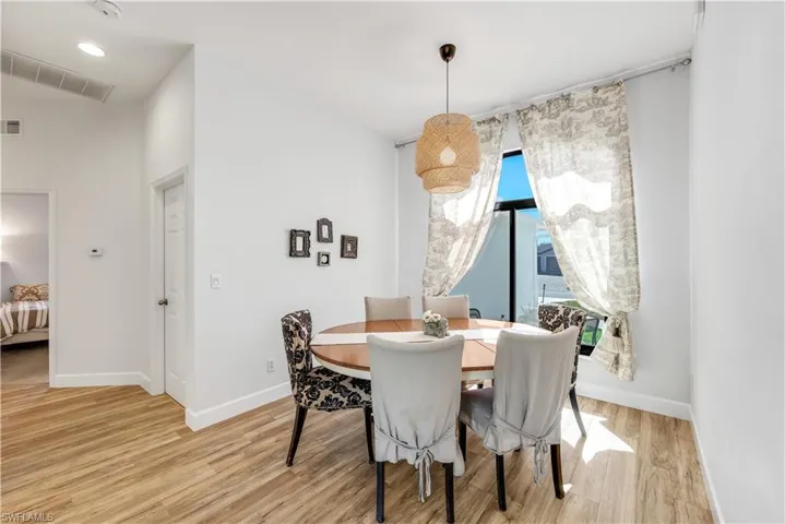 Dining area with light wood finished floors