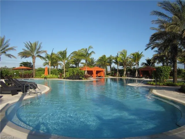 Community pool featuring a patio