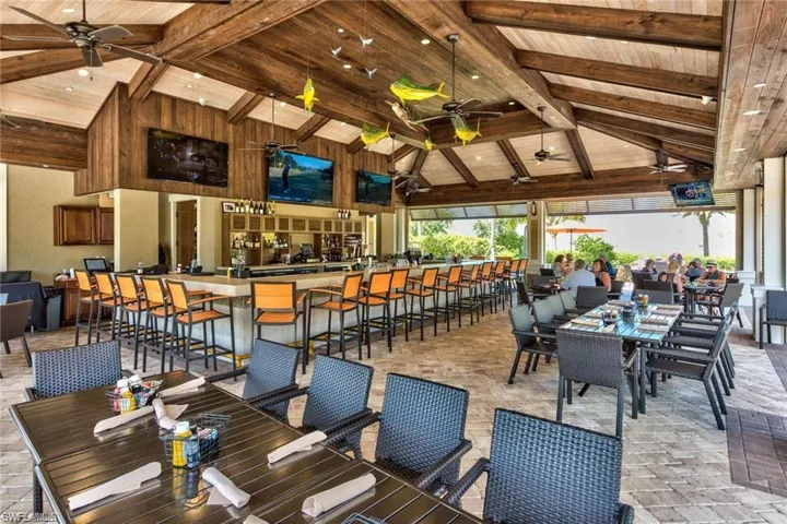 Dining room with wood ceiling, high vaulted ceiling, beamed ceiling, and a ceiling fan