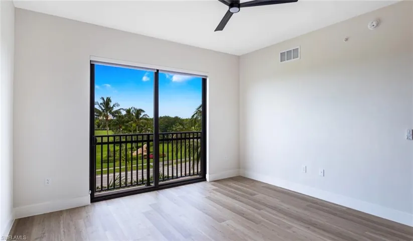 Spare room with light wood-style flooring and a ceiling fan