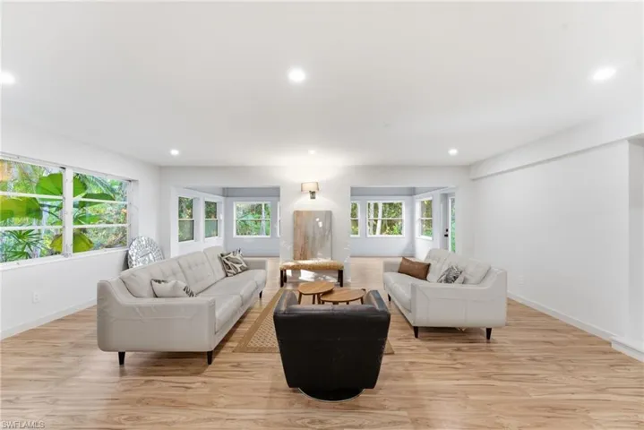 Living room featuring light wood finished floors and recessed lighting