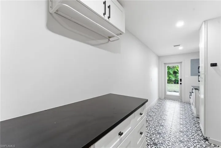 Mudroom featuring electric panel and recessed lighting