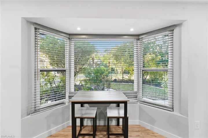 Dining space with light wood-type flooring and healthy amount of natural light