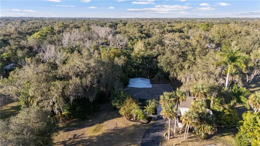 View from above of property with a forest