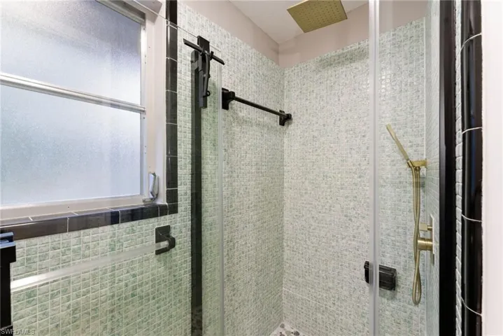 Full bath with a shower stall