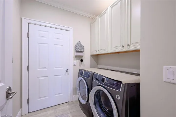 FUNCTIONAL IN RESIDENCE LAUNDRY LEADING TO GARAGE