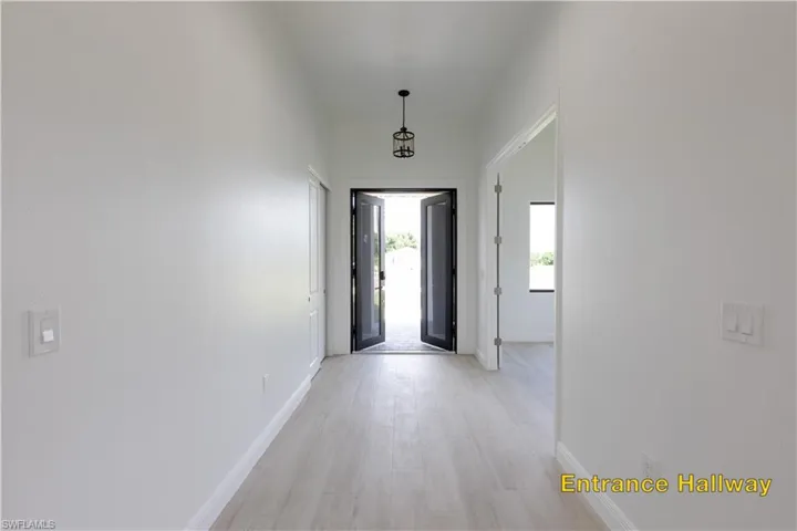 Back of property with a yard