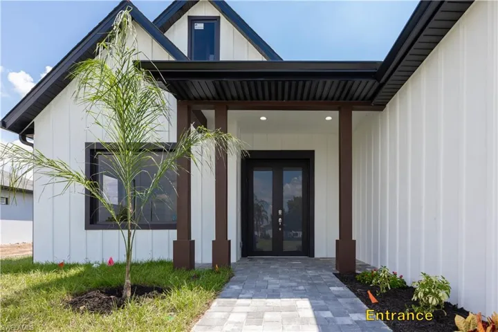 Modern farmhouse with a yard and a garage