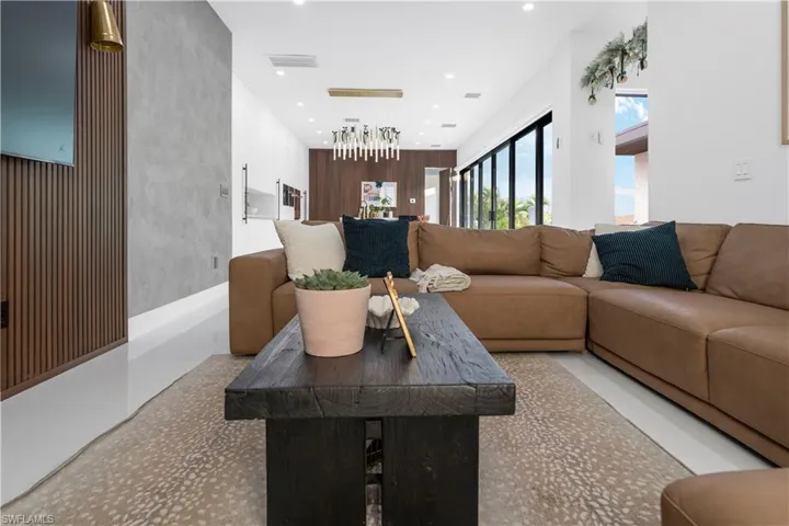 Living area featuring recessed lighting and an accent wall